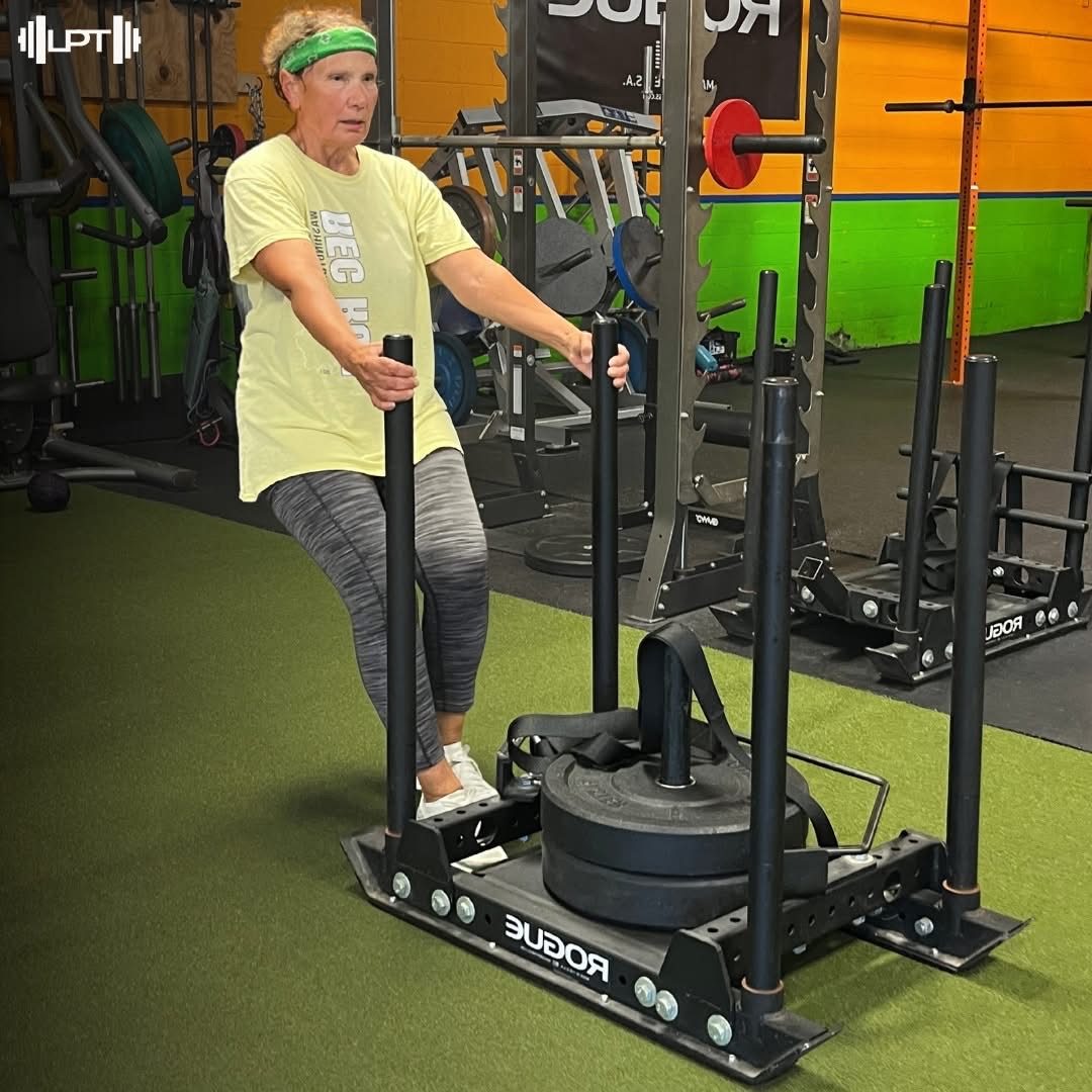 Member pushing sled